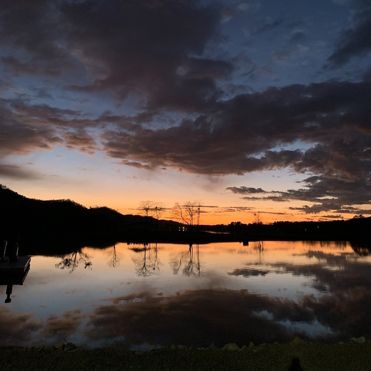 Cloudy dusk reflection on the lake