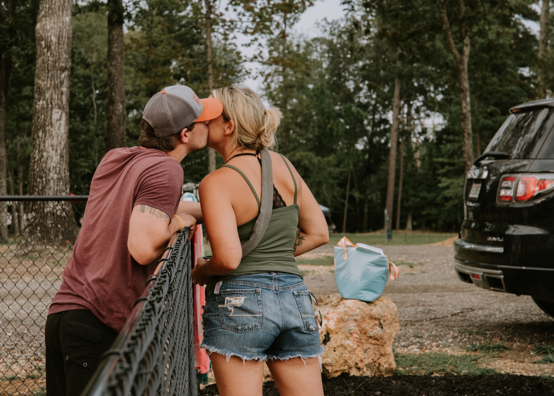 Couple sharing a kiss at the campground