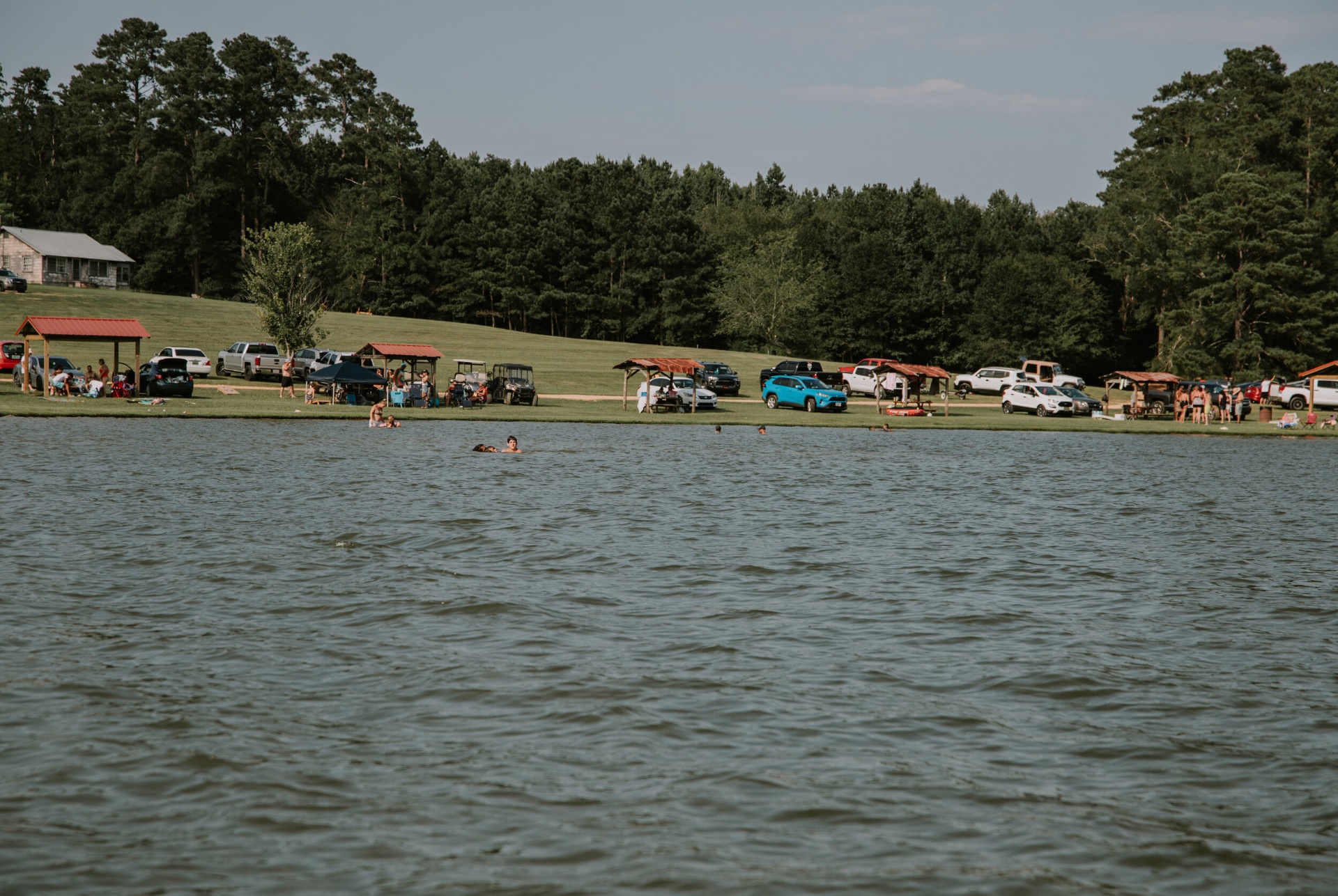 Families swimming and gathering across the lakefront